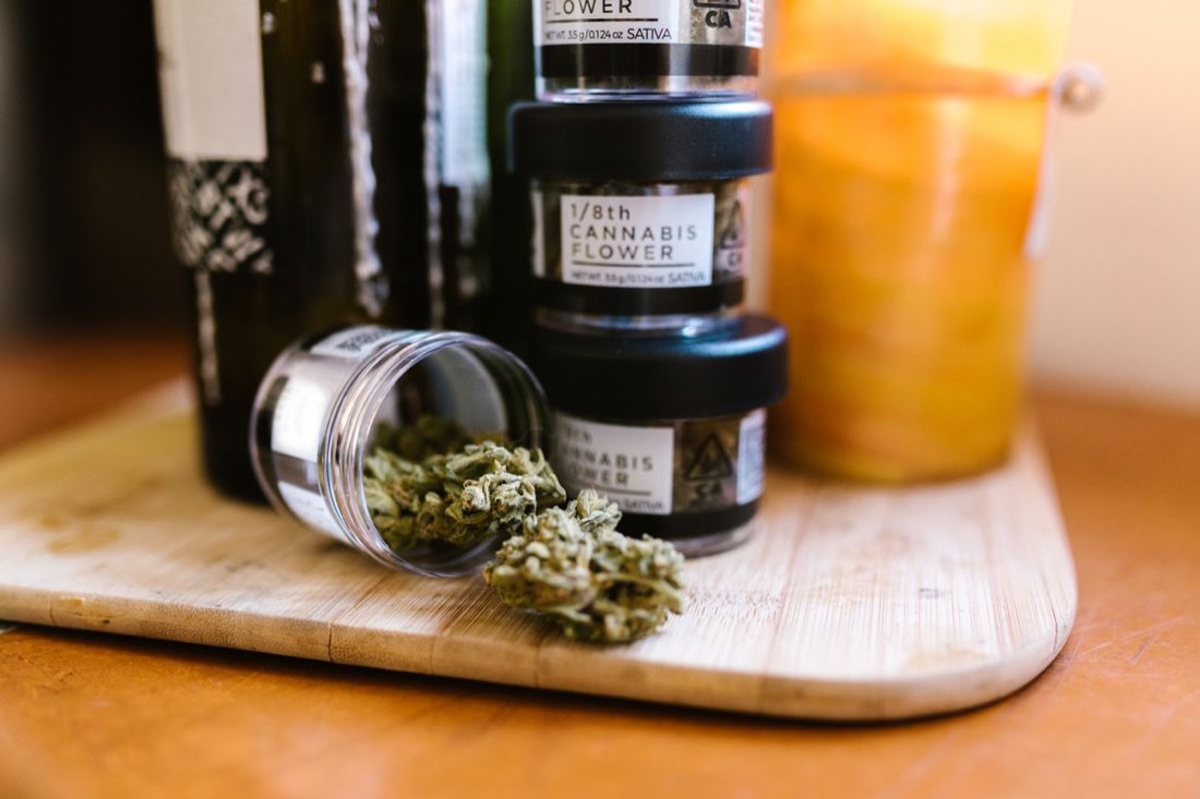 Labelled retail jars of cannabis flower